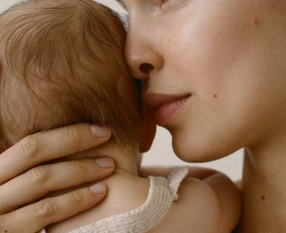 A quiet moment between a mother and her baby